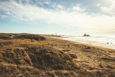 Scenic view of beach against sky