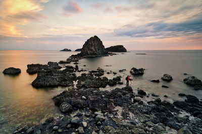 Scenic view of sea against sky at sunset