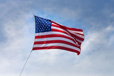 Low angle view of flag against sky