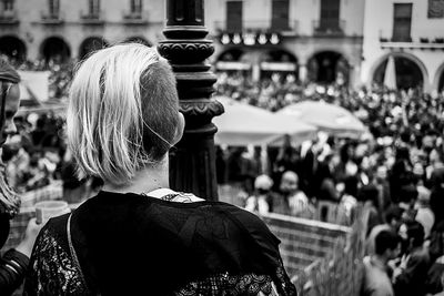 Close-up of woman looking at city