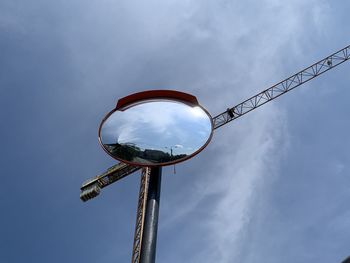 Low angle view of street light against sky