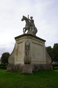 Low angle view of statue against sky