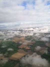 Aerial view of agricultural field against sky
