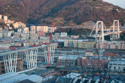 High angle view of bridge over river amidst buildings in city