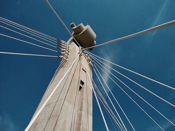 Low angle view of sailboat against blue sky