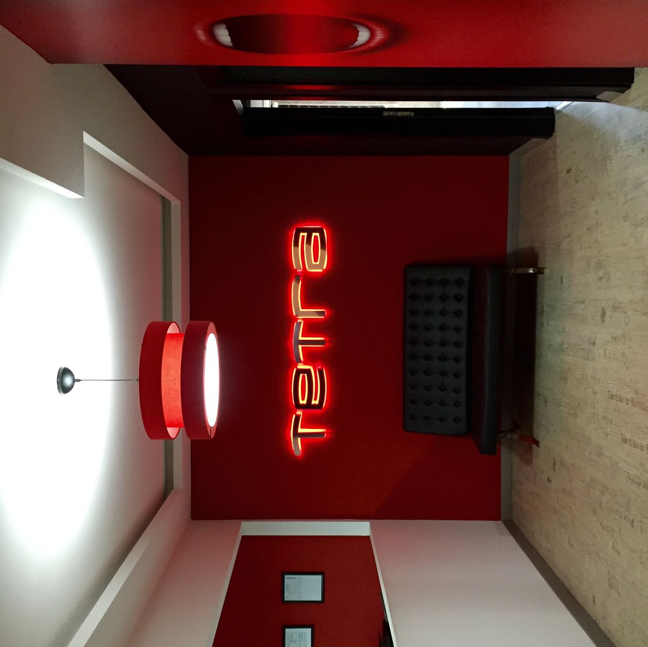 red, illuminated, indoors, architecture, built structure, lighting equipment, hanging, communication, text, no people, building exterior, low angle view, decoration, wall - building feature, in a row, western script, door, lantern, technology, electric light
