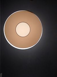 Low angle view of illuminated light bulb