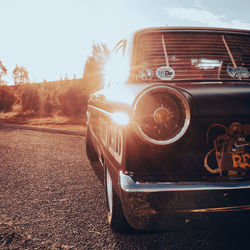 Close-up of vintage car on road