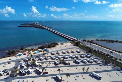 High angle view of swimming pool by sea against sky