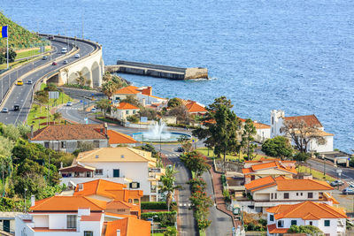 High angle view of town by sea