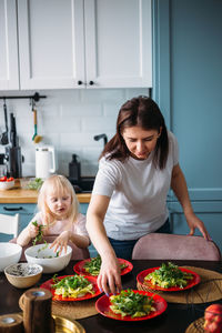 Female friends having food at home