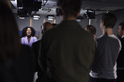 Audience applauding tv show host