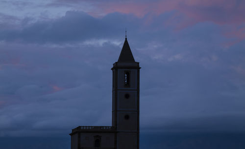 Church tower against cloudy sky during sunset. las salinas, cabo de gata nature park, almeria, spain