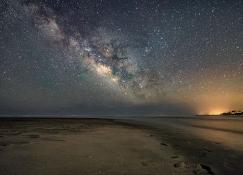 Scenic view of sea against sky at night