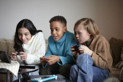 Children playing video games at home