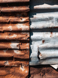 Old and rusty zinc sheet wall. vintage style metal sheet roof texture. pattern of old metal sheet. 