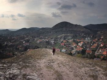 Crowd on mountain against sky