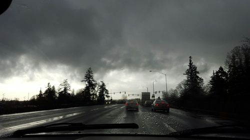 View of road against cloudy sky