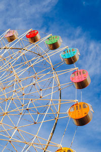 Low angle view of ferris wheel against sky