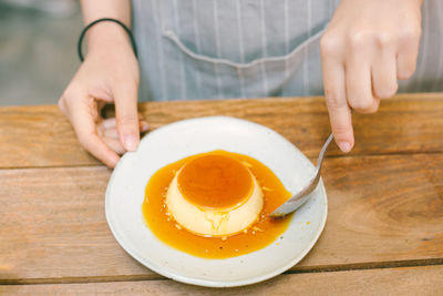 Midsection of woman preparing food on table