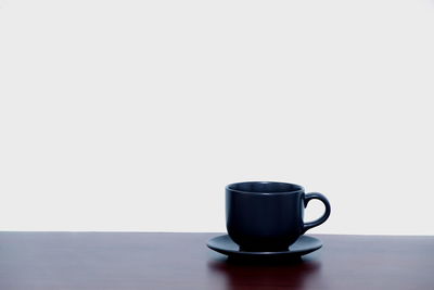 Close-up of coffee cup on table