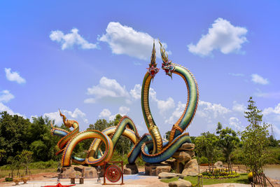 Low angle view of statue against blue sky