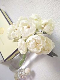 Close-up of white flower vase on table