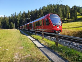 Train on railroad track against sky