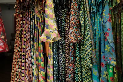 Close-up of dresses hanging in store