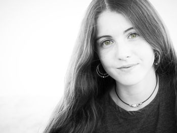 Portrait of a beautiful young woman over white background