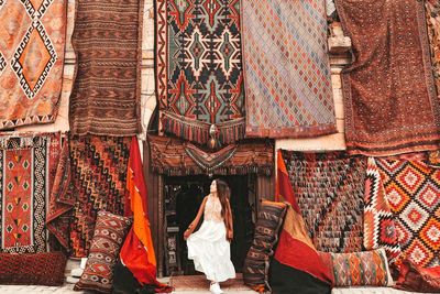 Rear view of woman hanging on clothesline