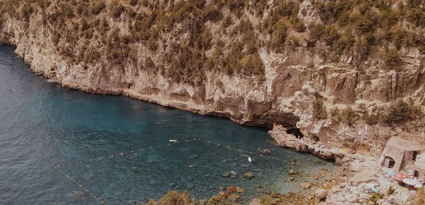 High angle view of rock formation in sea