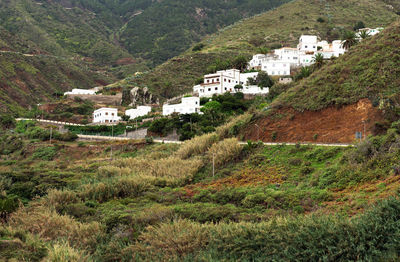 View of houses on hill