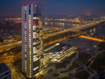 Hungary - budapest landscape with the amazing highest skyscraper, mol hq, from drone view at night