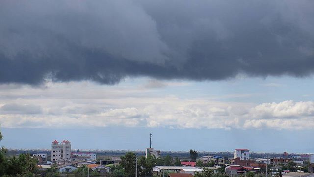 building exterior, architecture, built structure, sky, cloud - sky, cloudy, city, tree, residential building, car, residential structure, house, residential district, cloud, cityscape, transportation, high angle view, land vehicle, weather, town