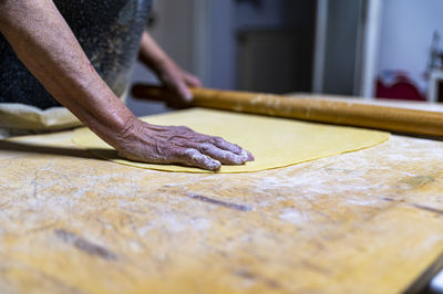 Close-up of person preparing food in kitchen