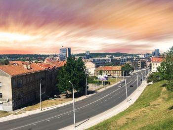 High angle view of road by buildings in city against sky