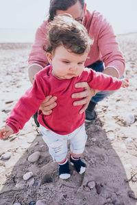 Father with baby standing outdoors