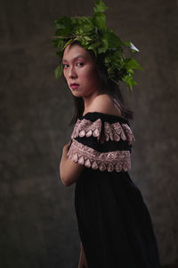 Portrait of a beautiful young woman standing outdoors