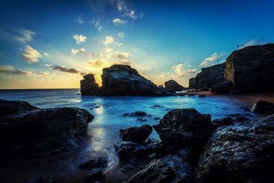 Scenic view of sea against sky at sunset