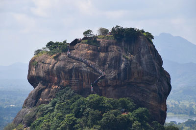 Scenic view of mountain against cloudy sky