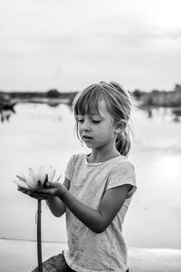 Cute boy looking at camera at beach