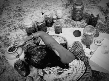 High angle view of woman preparing food outdoors