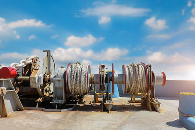 Panoramic shot of metal structure on field against sky