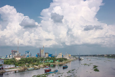 Panoramic view of sea and buildings against sky