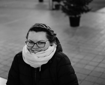 Portrait of smiling woman at shopping mall