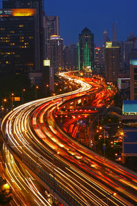 High angle view of light trails on road at night