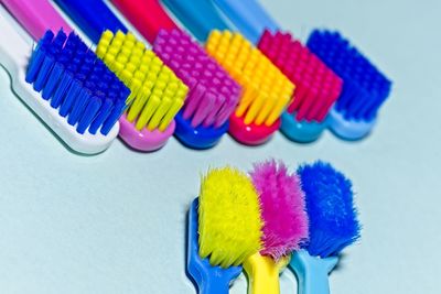 Close-up of brushes over blue background