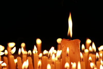 Close-up of lit candles in temple