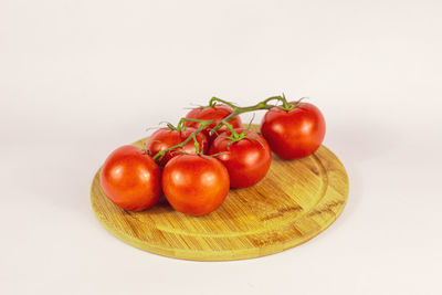 Close-up of cherry tomatoes against white background